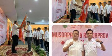 Fachruddin Siregar, S.T.,M.T Ketua ESI Rohul terima bendera petaka dari Brigjenpol. Bambang Hery Sukmajadi, S.H,.S.I.K Ketua ESI Riau.